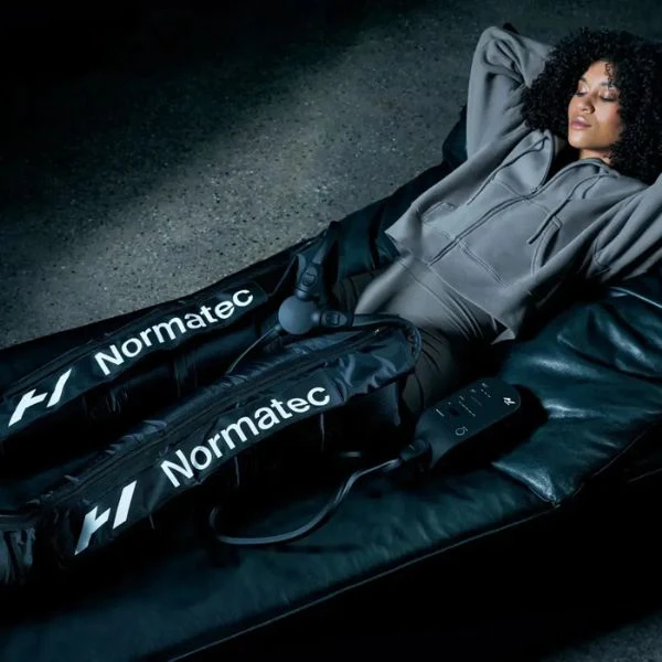 Athlete using Normatec compression boots